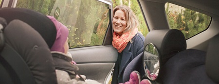 mother talking to daughter in car