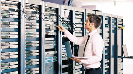 man working in server room